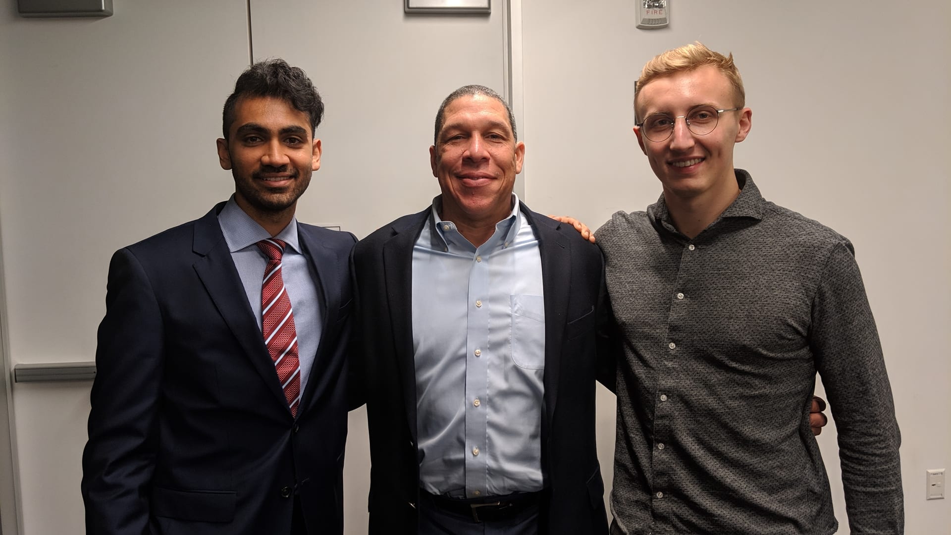 Darshan poses with former Executive Director Hal Biagas and former Vice President Greyson "Goldenglue" Gilmer.