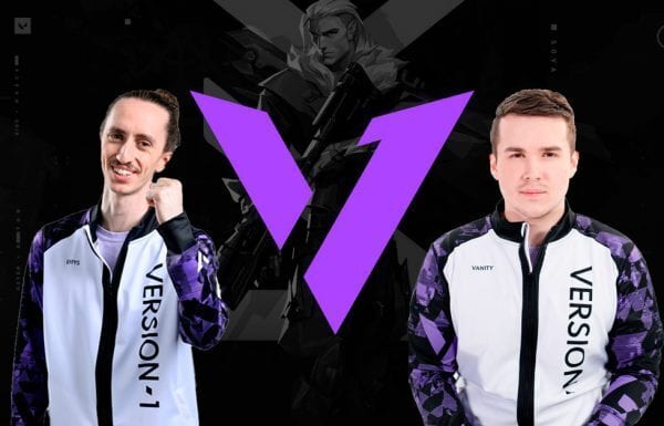 Version1 effys and Vanity pose in front of the team logo