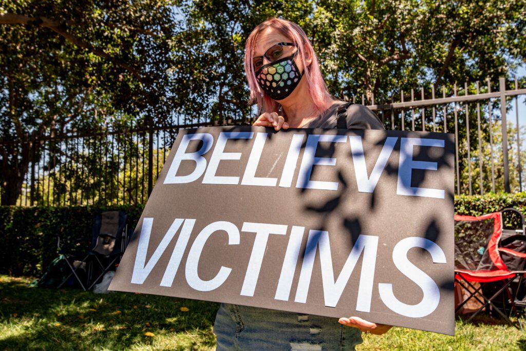 A protestor holds up a sign during the Activision-Blizzard Walkout