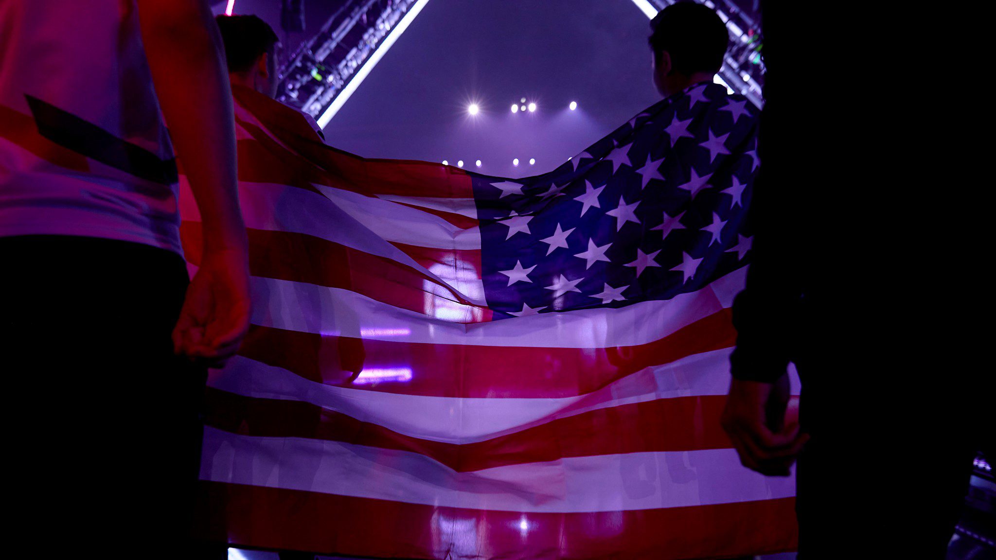 The NA flag held between two players at the event before VALORANT Champions