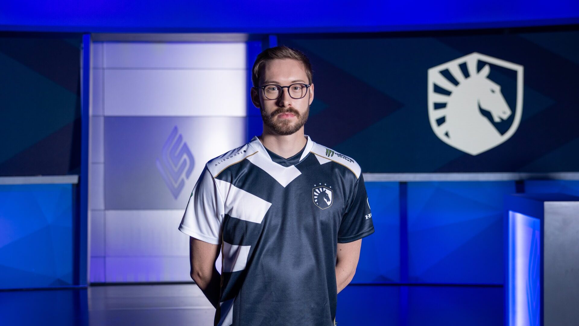 Bjergsen stands in the LCS Studio in Team Liquid gear