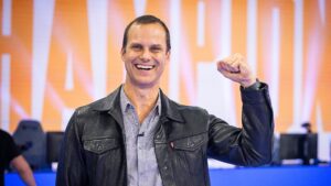 John Needham poses on stage at Worlds 2021