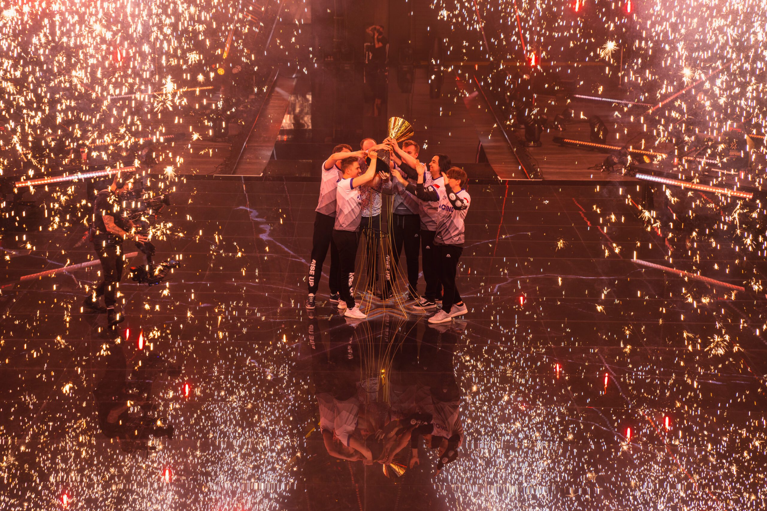 Team Acend celebrates with a Champions Trophy lift on stage after victory at the VALORANT Champions 2021 | Photo by Wojciech Wandzel/Riot Games