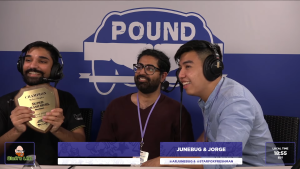 Zain holds up his trophy after winning Pound 2022 Melee Singles in an interview with Junebug and Jorge.